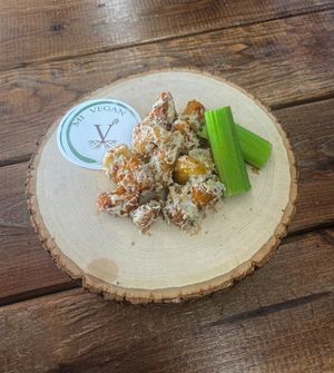 Midwest "Cauliflower" wings w/ house made garlic parmesan sauce  at M I Vegan Food Truck in Lansing
