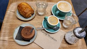 Cappuccino, coffe, pan au chocolat, tartellette au chocolat at Land & Monkeys - Roquette in Paris