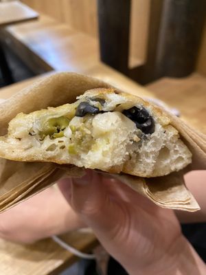 Petit pain aux olives  at Land & Monkeys - Roquette in Paris