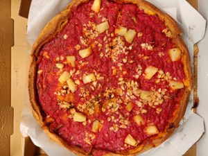 Vegan deep dish pizza: pineapple chunks, artichoke hearts, red onions, garlic, and spinach at Patxi's Pizza - Hayes Valley in San Francisco