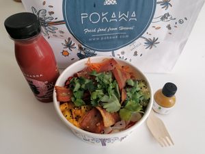 Poke bowl with vegan bacon, avodaco, mango, radish, carrots, and rice. at POKAWA in Nancy