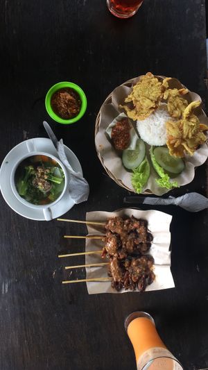 Indonesian food with a vegan twist! Rice with tempura, vegetable soup with mock meat, and mushroom satay with peanut sauce! Also ordered carrot juice and tea. Only cost RP70 000 at Soma Yoga - Vegi Jawi in Depok
