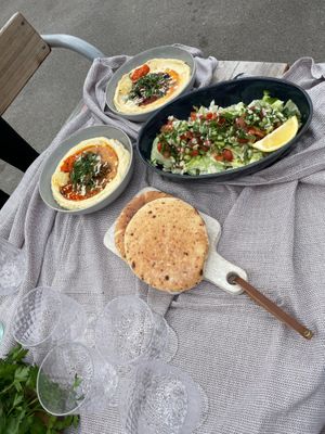 Hummus, Israeli Salad, fluffy Pita bread  at Taïm Streetfood in Vienna