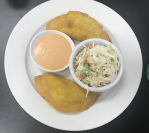 Veggie empanadas with coleslaw  at Earth To Us in Raleigh