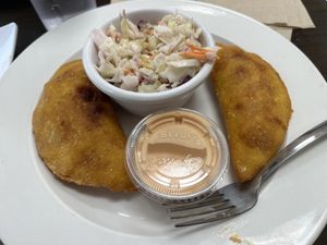 Arepas with boom boom sauce and coleslaw  at Earth To Us in Raleigh