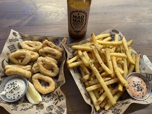 With fries and own brand vegan beer!  at Mad Mad Vegan - Lavapiés in Madrid