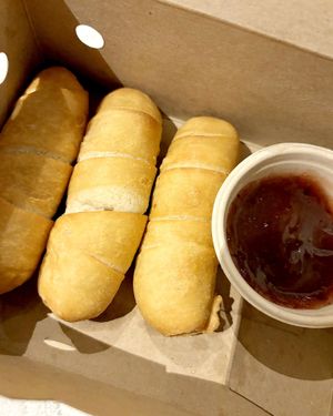 Mad Tequeños—venezuelan baked sticks filled with melted vegan cheese + red fruit jam at Mad Mad Vegan - Lavapiés in Madrid