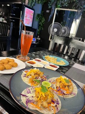 Chicken tacos, chicken nuggets, fries and a grapefruit soda    at Veganecessity Cafe in Phuket