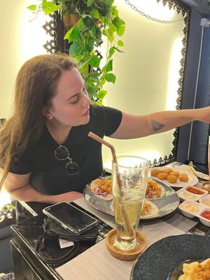 Me enjoying the variety of our order 😅  at Veganecessity Cafe in Phuket