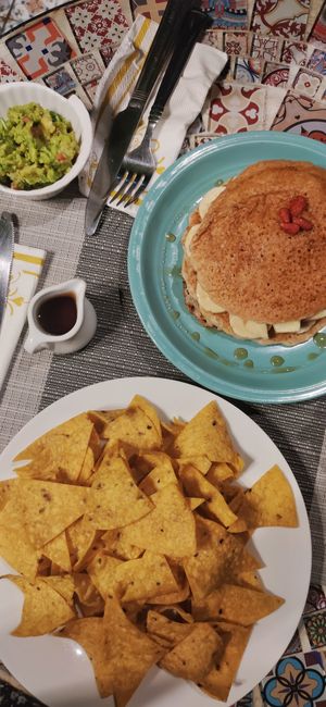 Nachos and pancakes with fruits at Veganecessity Cafe in Phuket