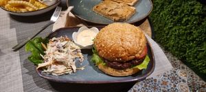 Bean burger with vegan coleslaw salad at Veganecessity Cafe in Phuket