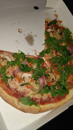 This pizza is supposed to have artichoke and cooked paprika and onion. What a joke. at Pizza Amsterdam in Amsterdam