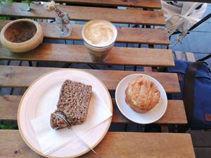 Poppy seed cake on the left, almond cake on the right and a soy cappuccino at Simonchu Cakes in Tel Aviv