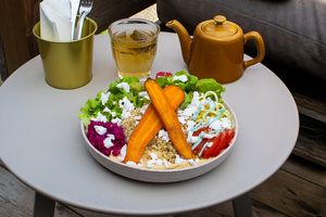 A loaded plate of tasty veggies. Filling and healthy quinoa, vegan feta, roasted carrots topped with an awesome dressing! at Maâbanana in Moliets