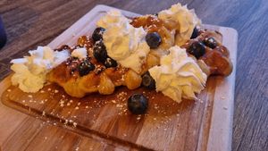 Waffles with cream and blueberries at Love Peace & Coffee in Edinburgh