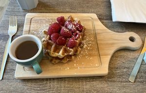 Vegan waffle with maple syrup and raspberries   at Love Peace & Coffee in Edinburgh