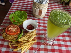 House made burger and fresh cut fries, lemon/lime afe at Rinconcito Vegano in Boquete
