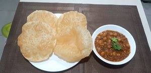 Chana masala & Poori 
Chana is known as Garbanzo  at Nirvana Foods Indian Vegan Restaurant and Grocery in Cozumel