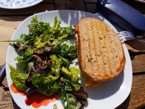omelette with humus and veggies inside bread slices and salad at tea and V in Sylt