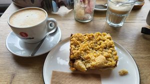 Streusel cake and oat milk Cappuccino at Das Glück Cafe in Darmstadt
