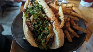 Mushroom philly cheese sandwich with seasoned fries at Element Gastropub in Raleigh