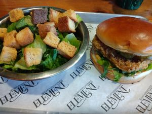 Crispy Chick'n Sandwich and a side of Kale Caesar salad. at Element Gastropub in Raleigh