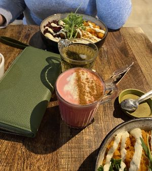 Buddha bowl, green tea and beetroot latte (oat milk)  at Ebike Cafe at Deheers in Weymouth