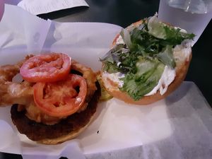 Burger with onion rings at 2 Guys Pizza in Hendersonville