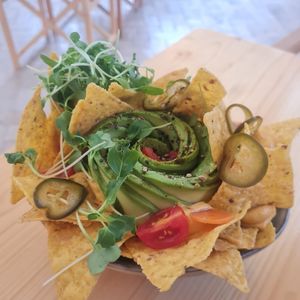 Vegan nachos with cheesy sauce and Avocado at Nibs Healthy Bar in Menorca