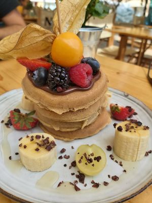 Vegan pancakes with chocolate spread and fresh fruit at Nibs Healthy Bar in Menorca