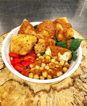 Chickun Masala Bowl. Fried chickun, brown rice, bell peppers, chick peas, baby spinach, savoury and spicy masala sauce.  Vegan, Gluten free, Halal at Blissful Bird in Toronto