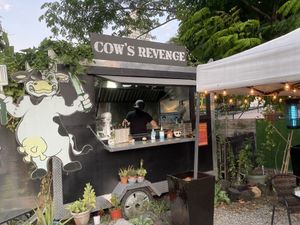 Food truck in a lot of other food trucks  at Cow's Revenge Vegan in Panama City