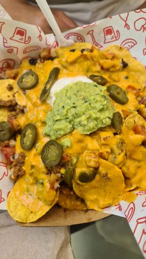 The nachos (with heaps of toppings) were yummy. at Cow's Revenge Vegan in Panama City