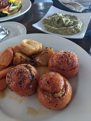 Gemista Stuffed Tomatoes (vegan). Forgot what the dip behind it is called, but it was really good, also vegan. at The Greek in Ventura
