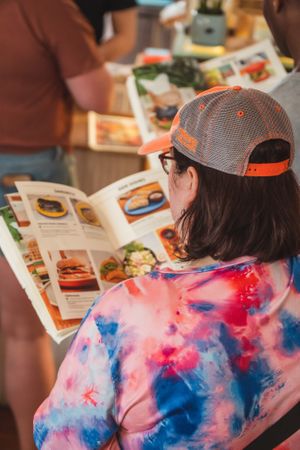 The menu look like a magazine at iVegan Supershop Da Nang - Healthy Plant Based Cafe in Da Nang