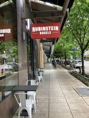 Exterior entrance and seating  at Rubinstein Bagels in Seattle