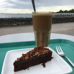 Oat latte & chocolate cake. at Café Ursula in Helsinki