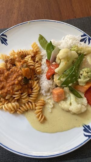 Main: Soy Bolognese with pasta. Rice with curried veggies. Usually you can choose one. Staff was nice and gave me both! So good   at Ca n'Ela Vegan Restaurant in Mallorca