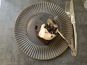 Chocolate cake and cream sauce.   at Ca n'Ela Vegan Restaurant in Mallorca