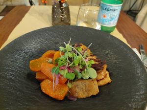 Marinated sautéed in-house seitan with roasted sweet potato and carrot at Ca n'Ela Vegan Restaurant in Mallorca