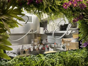 Ca N’ela. Viewing window into the kitchen.  at Ca n'Ela Vegan Restaurant in Mallorca