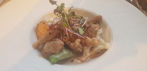 Heura with bimi and cauliflower served with satay sauce at Ca n'Ela Vegan Restaurant in Mallorca