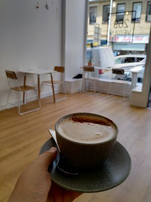 Cup of coffee in the bright spacious cafe at 269 Vegan in Dunfermline