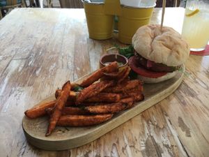Veggie burger with sweet potato fried (probably not vegan tho) at MaiMai Surf Bar in Mallorca
