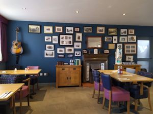 Lovely interior I feel, can't go wrong with a guitar. at The Swan in Banton