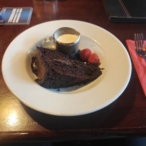 Hot chocolate fudge cake with plant based cream at The Tyndrum Inn in Crianlarich
