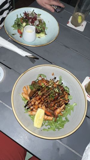 Salad at the top. Lentil pasta at the bottomm  at Sunset Bar & Grill in Broome