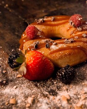Clove and Cinnamon Donuts. With sugar icing, brush strokes of dulce de leche, cloves and cinnamon. at A Coruja in Sao Paulo