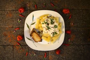 Rigattone with Bechamel Sauce. Accompanies toast with garlic paste and a grill of your choice at A Coruja in Sao Paulo
