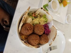 Falafel bowl with hummus and vegan salad dressing with toasted pita bread. Delicious!! at Allan's Mediterranean Bar and Grill in Middletown